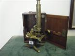 Mahogany cased brass microscope, with numerous fittings and attachments, including Bulls eye lens