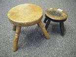 Children`s size milking stool c1850`s one leg replaced and 1 other milking stool with elm top,