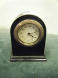 Small ebony arched topped bedside clock, 8 day movement,