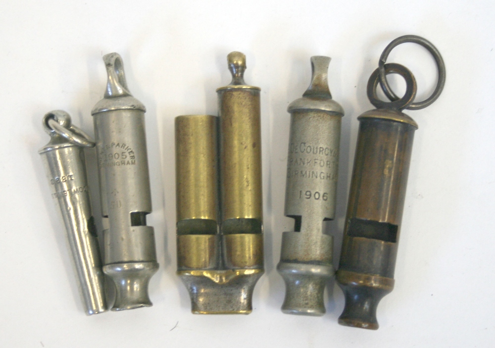 Five Various Whistles of various types including a brass double tube