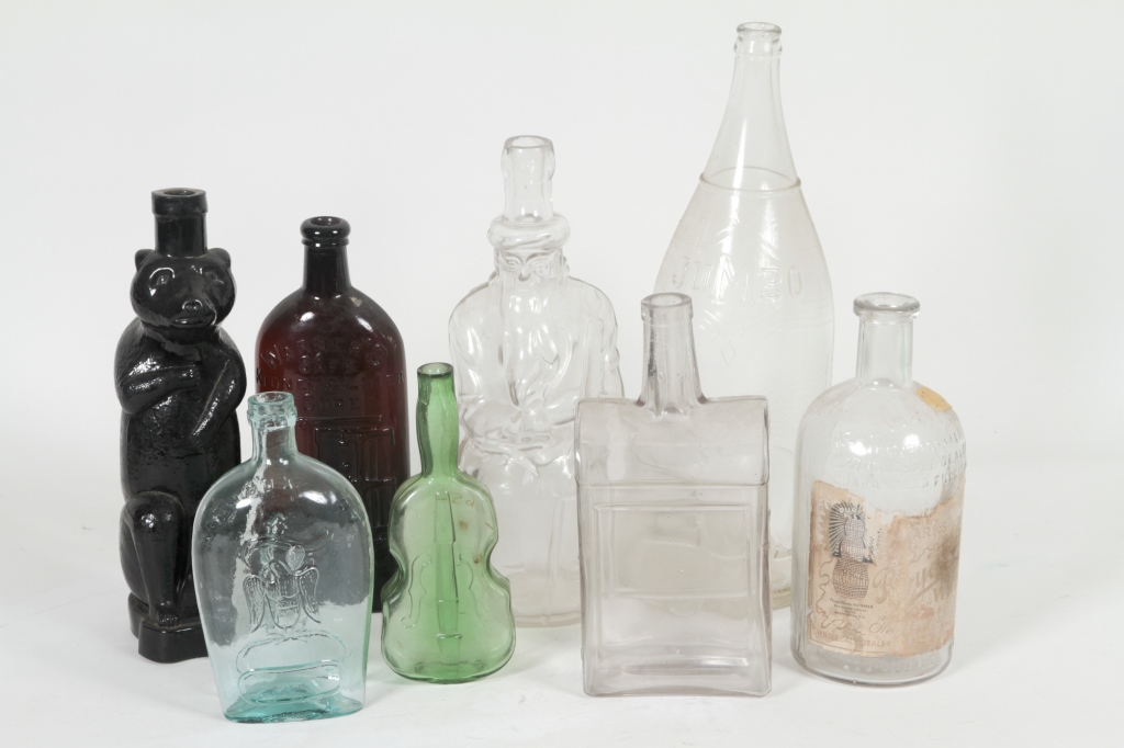 Eight Old Glass Bottles includes J. C Marks on Glass | Old glass bottles