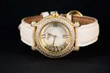 CHOPARD « happy diamonds » A yellow gold and diamond lady’s wrist watch by Chopard, with a white