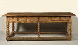 A CARVED TABLE, First half of 17th century, Spain Carved table with three drawers and footrest.