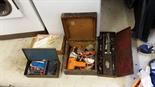 A black and decker sander, socket set, metal box with riveter, drill in wood box.