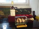 A wine set and a ship in a bottle.