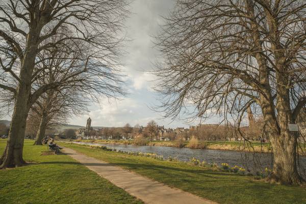 Image of John Buchan (1875-1940) was born in Perth and spent his childhood holidays at his grandparents’ house in Tweeddale, in the South of Scotland. This area had no small impact on Buchan – indeed, in 1935, after his election to the House of Lords, he took the name Lord Tweedsmuir. 

He was a prolific author, writing 130 books in total and contributing to a further 150, as well as producing essays, poems, articles, reviews, and journalism. His most famous works featured the character Richard Hannay, e.g. ‘The Thirty-Nine Steps’. 

Despite an international reputation and a life spent travelling Africa, Europe and North America, Buchan remained devotedly attached to Scotland. In his poem 'The South Countrie', as well as in many other works, he goes further, preferring the South of Scotland to every other part of Scotland. 

Don't forget to:
Check walk the John Buchan Way from Peebles to Broughton.
Or to visit Dumfries and Galloway - stay at Knockinaam Lodge where Buchan was a guest. The stream that runs past the lodge was the inspiration for the House that Hannay fled to away from the police in 'The 39 Steps'. 
Buchan explored Galloway and spent a lot of time cycling, covering 65 miles of the hills in 24 hours in 1897. Three novels (Dickson McCumm trilogy) and 1 short story are Galloway set. In Buchan's landscape "Portaway" is Newton Stewart, "Gledmouth" is Dumfries, "Castle Gay" is the Castle of Old Risk and "Fallatown" is Wigtown, as well as the district of Carrick in Galloway where the action for 'Huntertower' took place.