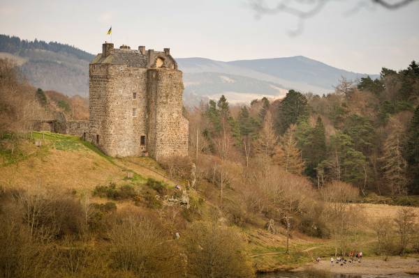 Image of John Buchan (1875-1940) was born in Perth and spent his childhood holidays at his grandparents’ house in Tweeddale, in the South of Scotland. This area had no small impact on Buchan – indeed, in 1935, after his election to the House of Lords, he took the name Lord Tweedsmuir. 

He was a prolific author, writing 130 books in total and contributing to a further 150, as well as producing essays, poems, articles, reviews, and journalism. His most famous works featured the character Richard Hannay, e.g. ‘The Thirty-Nine Steps’. 

Despite an international reputation and a life spent travelling Africa, Europe and North America, Buchan remained devotedly attached to Scotland. In his poem 'The South Countrie', as well as in many other works, he goes further, preferring the South of Scotland to every other part of Scotland. 

Don't forget to:
Check walk the John Buchan Way from Peebles to Broughton.
Or to visit Dumfries and Galloway - stay at Knockinaam Lodge where Buchan was a guest. The stream that runs past the lodge was the inspiration for the House that Hannay fled to away from the police in 'The 39 Steps'. 
Buchan explored Galloway and spent a lot of time cycling, covering 65 miles of the hills in 24 hours in 1897. Three novels (Dickson McCumm trilogy) and 1 short story are Galloway set. In Buchan's landscape "Portaway" is Newton Stewart, "Gledmouth" is Dumfries, "Castle Gay" is the Castle of Old Risk and "Fallatown" is Wigtown, as well as the district of Carrick in Galloway where the action for 'Huntertower' took place.