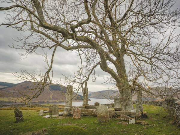 Image of James Hogg was born in a small cottage on Ettrickhall Farm at the top of the Ettrick Valley in 1770. He was the second son of Robert and Margaret Hogg (nee Laidlaw). Robert Hogg tried farming but soon became bankrupt and at the age of six, James had to leave school to perform the most menial tasks of farm service. 

At the age of eleven, he became a shepherd watching the flocks as they grazed on the unfenced hills. While there, he practised reading with the encouragement and use of his master's library. By the time he was eighteen he could read proficiently, and write well but slowly at twenty-four. 

Although he had little formal education, Hogg was fortunate in his family connections. His mother and her family had a great fund of the oral traditions of the Border Ballads, the folklore and superstitions of the country people. His father was of Covenanting stock and from his side of the family, Hogg observed the effect of over-zealous Calvinism. 

This background was his basic material as a poet, storyteller and songwriter. 

With most of his life spent in the hill country, familiar stories, places and people appear in his works, often thinly disguised. Hogg was a collector of the oral and musical traditions of the Borders and when a young lawyer called Walter Scott was seeking fragments of ballads in the Ettrick Forest in 1801, it was little wonder that he asked Jamie the Poeter to be his guide. This was to be the start of a friendship which lasted until Scott's death in 1832. 
Hogg had published in his own right but Scott introduced him to the literary establishment of the Edinburgh Enlightenment. Soon Hogg was taking his place amongst them as their equal or even superior in published prose and poetry. 

His epic poems The Queen's Wake', Mador of the Moor and 'Queen Hynde' bear comparison to any, while his The Confessions of a Justified Sinner' is recognised as a major prose work of the century. 

Many of the literati of Edinburgh professed to look down on the unlettered countryman while still being envious of his talents. Hogg probably knew this and played up to his country shepherd image as he describes himself in The Queen's Wake. 

"But when the bard himself appeared, 
The ladies smiled, the courtiers sneered 
For such a simple air and mein 
Before the court had never been 
A clown he was, bred in the wild, 
And late from native moors exiled". 

As well as being a literary success, Hogg had a constant ambition to the higher praise in Ettrick Forest of being 'a farmer'. Here, he was much less successful; money made by his pen was lost in a series of farming failures. Such was his determination to be seen to have made good in the eyes of his neighbours, that when Sir Walter Scott obtained two seats for himself and Hogg at the Coronation of George IV in Westminster Abbey, Hogg refused on the grounds that it was at the same time as the great St Boswells Fair and no new farmer could afford to miss that. 

James Hogg married Margaret Phillips in 1820 at the age of fifty. When he died fifteen years later, he left a family of one son and four daughters. After a space of twenty years, his widow received a yearly pension of £100 until she died in 1870.