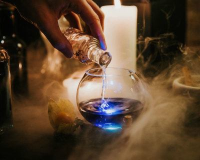 The Cauldron making blue cocktail