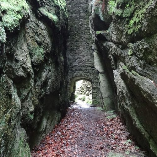 Small gate on the outer side of a rocky gorge.