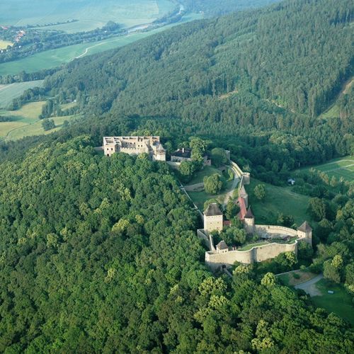 View from the west of a protruding peak of the Maleník Massif, on which Helfštýn Castle was built. The image illustrates the difference in altitude between the high plain of the castle hill and the levelled surface of the Bečva Gate. Krásnice Hill can be seen on the right of Helfštýn. 