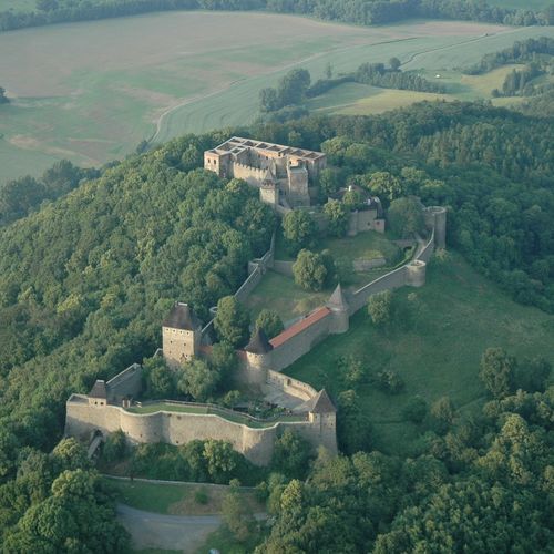 Overall aerial photo of the vast area of Helfštýn Castle from the south; Bečva Gate can be seen in the background. 