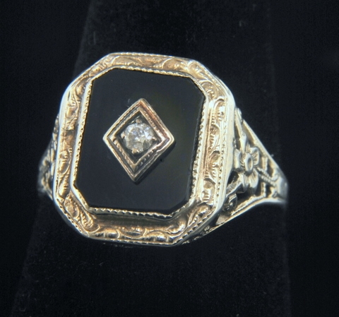 black onyx ring with diamond in center