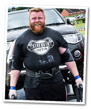 John Clark Lifting a Truck