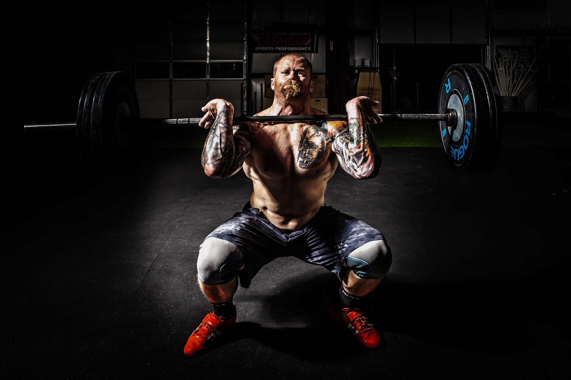 man lifting weights