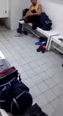 Naked man sliding into changing room