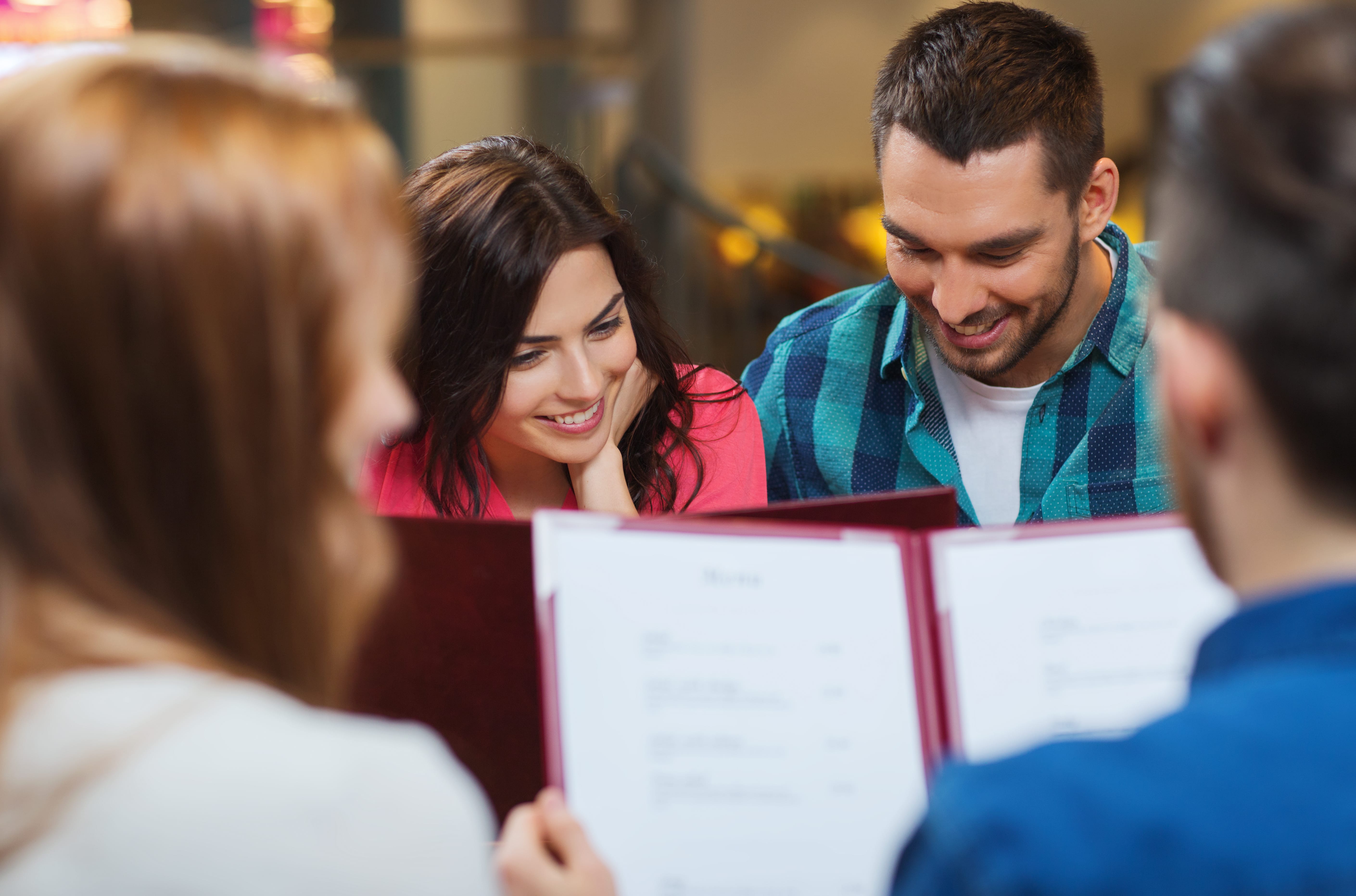 Reading menu at restaurant