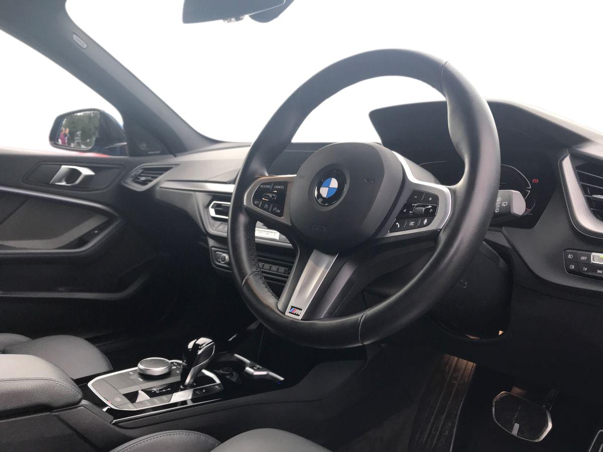 2024 BMW 1 Series BMW 1 SERIES 118i [136] M Sport 5dr Step Auto [LCP] Front sports seats, Height adjustable front head restraints, 3 rear seat head restraints, 3 seat bench in 2nd row, Driver and front passenger seat heating, Child seat ISOFIX attachment for two outer rear seats and front passenger seat with anchorage points, Single front passenger seat, M sport suspension, Anti roll bar front and rear, Drive Performance Control, Twin tube gas filled shock absorbers with degressive characteristic curve, On board computer, Personal Profile, BMW Teleservices, Optimum shift indicator, Oil sensor for level and grade, Check Control warning system for monitoring of lights and door/luggage compartment open warning, Integrated owners handbook, BMW ConnectedDrive online services, Rigidly mounted rear subframe - Multi link construction with separate spring / damper configuration and excellent driving characteristics, Locking wheel bolts, Central locking switch for all doors, fuel filler cap and luggage compartment, Thatcham Cat.1 alarm and immobiliser, Deadlocking function system to all doors, Remote control with integrated key with High-gloss Black inlay and M designation and 1 button for open/ close lock, window, open luggage compartment, Drive away locking system on all doors and luggage compartment with de-activated in iDrive settings, Wheel slip limitation close to the actuator (ARB), Start/stop button illuminated in centre console with keyless engine start and auto start stop deactivation button, Side impact protection, Seatbelt warning, Warning triangle and first aid kit, Tyre pressure monitoring system, BMW emergency call, 2 tone horn, Driver and front passenger seat belt security check, 3 point seatbelts on all seats, front pyrotechnic belt tensioners, stopper and belt force limiters, rear coded belt buckles, Child proof locking system in rear door, Crash sensor activating central locking release, hazard warning lights, fuel cut off, interior lighting + activation of safety battery terminal clamp, Airbags - Front driver/passenger, front and rear curtain head protection, front side, manual deactivation of front passenger airbag, Crash sensor activating of airbags, Unlocking doors, hazard warning lights, interior light, safety battery terminal, Anthracite headlining, Manual adjust steering wheel, Glove compartment, Front armrest, Multi-function controls for steering wheel, Folding rear clothes hook, Storage compartment in luggage compartment, Storage compartment in centre console, Front and rear door pockets with bottle holders, Conditioned based service, Four grab handles integrated in roof lining, Front and rear side armrest integrated into door trim, Driver and front passenger backrest net on rear, Dakota leather upholstery with perforation and contrast stitching, Driver side folding compartment in instrument panel, 12V power socket in front centre console with blanking plug, Type C two USB ports in rear centre console, Stowage of the parcel shelf in luggage compartment trim, 3 spoke sports leather steering wheel with black leather and stitching, pearl chrome decorative finish, specific M Badge, Two front centre console cupholders, Luggage compartment for bag hooks on left and right, foldable luggage compartment liner and two lashing eyelets, Luggage compartment for bag hooks on left and right, foldable luggage compartment liner and four lashing eyelets, Cargo function on 2nd seat row, Black boot net with lashing eyes, Body colour door handles, Shark fin antenna, Visible VIN plate, Front and rear bumper system with replaceable deformation elements, Lightweight engineering, Chrome 'M' logo side designation, Body colour roof trims, Fading support, Matt black air guide grilles, Chrome kidney grille frame with Satin Aluminium struts, Front door sill finishers in black plastic with M designation in metallic look, High gloss shadowline window frame, Recess cover mirror frames and B/C pillar embelisher trim, Model designation on electric bootlid, Chrome exhaust twin tailpipes round 90mm in left, Matt black wheel arch trim, Rear side wing doors, High level third brake light, Follow me home headlights, Automatic headlight beam throw control, Welcome lighting, LED daytime running lights, LED Headlights, LED front fog lights, Rear fog lights, Direction indicator side lights in exterior mirrors, Nearside reverse light in rear light cluster, LED eyebrow turn indicators, Preparation for high beam assistant, Auto dimming rear view mirror, Body colour mirror caps, Heated, electrically adjustable exterior mirror aspheric on driver side, convex on passenger side, Folding side mirrors with auto dimming/folding wing mirrors with auto dimming, Electrically adjustable exterior mirror with mirror adjustment switch on drivers armrest and aspheric on driver side, convex on passenger side, Cornering brake control, Dynamic Traction Control - DTC, Brake drying, Front and rear disc brakes, Anti lock braking system (ABS) with brake assist, Braking readiness, Dynamic stability control + (DSC+), City braking function, Electrically operated hand brake including automatic hold function, Comfort modes, Lane departure warning system, Cruise control with brake assist, Speed limiter, Attentiveness assist, Active guard plus, Cruise control with speed limiter, Front axle single joint with specific axle kinematics to minimise drive influences on steering + provide increased rigidity agile driving behaviour, Speed limit Info including no-overtaking indicator, Ambient interior lighting, DAB Digital radio, Stereo speaker system with 2 mid range speakers in the front door trims and rear parcel shelf + 2 central bass speakers underneath the front seats, Interior lights pack - 1 Series, Connected pack professional - 1 Series, M Sport exterior styling aerodynamics pack - 1 Series, Additional interior lighting pack - 1 Series, Additional storage compartment pack - 1 Series, BMW live cockpit professional pack- 1 Series, Additional storage compartment pack with code 493 -1 series, Electronic differential lock, 7 speed automatic transmission with double clutch technology, Petrol Particulate Filter, High precision injection, Balancer shaft, VALVETRONIC engine management, Aluminium lightweight construction, Double VANOS twin scroll turbocharging system, Velour floor mats, Floor mats in anthracite velour with contrasting colour seam to match contrast stitching on instrument panel, Rear window wiper, Green tinted heat protection glazing, Front and rear electric windows with open and close fingertip control, anti trap facility and comfort closing, Automatic windscreen wipers and automatic headlight, Integrated front windscreen with washer jets, Reduced rolling resistance tyres, Electrically powered 12V compressor, Eco pro mode, Pull away assistant, Two zone automatic air conditioning, Contrast stitching on instrument panel, 18" Burnished M double spoke bi-colour alloy wheels finished in orbit grey - style 819M, Sun visors with vanity mirrors and insert tab, Bluetooth / WiFi interface for wireless connection of mobile terminal devices and audio streaming, Trailer stabilisation logic - vehicle photo 3 for sale on PureCar