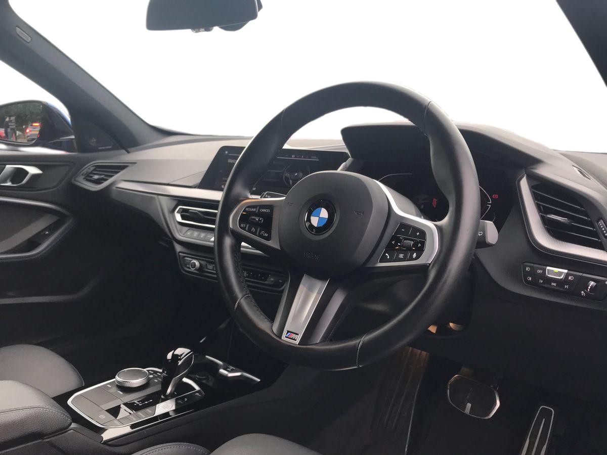 2024 BMW 1 Series BMW 1 SERIES 118i [136] M Sport 5dr Step Auto [LCP] Front sports seats, Height adjustable front head restraints, 3 rear seat head restraints, 3 seat bench in 2nd row, Driver and front passenger seat heating, Child seat ISOFIX attachment for two outer rear seats and front passenger seat with anchorage points, Single front passenger seat, M sport suspension, Anti roll bar front and rear, Drive Performance Control, Twin tube gas filled shock absorbers with degressive characteristic curve, On board computer, Personal Profile, BMW Teleservices, Optimum shift indicator, Oil sensor for level and grade, Check Control warning system for monitoring of lights and door/luggage compartment open warning, Integrated owners handbook, BMW ConnectedDrive online services, Rigidly mounted rear subframe - Multi link construction with separate spring / damper configuration and excellent driving characteristics, Locking wheel bolts, Central locking switch for all doors, fuel filler cap and luggage compartment, Thatcham Cat.1 alarm and immobiliser, Deadlocking function system to all doors, Remote control with integrated key with High-gloss Black inlay and M designation and 1 button for open/ close lock, window, open luggage compartment, Drive away locking system on all doors and luggage compartment with de-activated in iDrive settings, Wheel slip limitation close to the actuator (ARB), Start/stop button illuminated in centre console with keyless engine start and auto start stop deactivation button, Side impact protection, Seatbelt warning, Warning triangle and first aid kit, Tyre pressure monitoring system, BMW emergency call, 2 tone horn, Driver and front passenger seat belt security check, 3 point seatbelts on all seats, front pyrotechnic belt tensioners, stopper and belt force limiters, rear coded belt buckles, Child proof locking system in rear door, Crash sensor activating central locking release, hazard warning lights, fuel cut off, interior lighting + activation of safety battery terminal clamp, Airbags - Front driver/passenger, front and rear curtain head protection, front side, manual deactivation of front passenger airbag, Crash sensor activating of airbags, Unlocking doors, hazard warning lights, interior light, safety battery terminal, Anthracite headlining, Manual adjust steering wheel, Glove compartment, Front armrest, Multi-function controls for steering wheel, Folding rear clothes hook, Storage compartment in luggage compartment, Storage compartment in centre console, Front and rear door pockets with bottle holders, Conditioned based service, Four grab handles integrated in roof lining, Front and rear side armrest integrated into door trim, Driver and front passenger backrest net on rear, Dakota leather upholstery with perforation and contrast stitching, Driver side folding compartment in instrument panel, 12V power socket in front centre console with blanking plug, Type C two USB ports in rear centre console, Stowage of the parcel shelf in luggage compartment trim, 3 spoke sports leather steering wheel with black leather and stitching, pearl chrome decorative finish, specific M Badge, Two front centre console cupholders, Luggage compartment for bag hooks on left and right, foldable luggage compartment liner and two lashing eyelets, Luggage compartment for bag hooks on left and right, foldable luggage compartment liner and four lashing eyelets, Cargo function on 2nd seat row, Black boot net with lashing eyes, Body colour door handles, Shark fin antenna, Visible VIN plate, Front and rear bumper system with replaceable deformation elements, Lightweight engineering, Chrome 'M' logo side designation, Body colour roof trims, Fading support, Matt black air guide grilles, Chrome kidney grille frame with Satin Aluminium struts, Front door sill finishers in black plastic with M designation in metallic look, High gloss shadowline window frame, Recess cover mirror frames and B/C pillar embelisher trim, Model designation on electric bootlid, Chrome exhaust twin tailpipes round 90mm in left, Matt black wheel arch trim, Rear side wing doors, High level third brake light, Follow me home headlights, Automatic headlight beam throw control, Welcome lighting, LED daytime running lights, LED Headlights, LED front fog lights, Rear fog lights, Direction indicator side lights in exterior mirrors, Nearside reverse light in rear light cluster, LED eyebrow turn indicators, Preparation for high beam assistant, Auto dimming rear view mirror, Body colour mirror caps, Heated, electrically adjustable exterior mirror aspheric on driver side, convex on passenger side, Folding side mirrors with auto dimming/folding wing mirrors with auto dimming, Electrically adjustable exterior mirror with mirror adjustment switch on drivers armrest and aspheric on driver side, convex on passenger side, Cornering brake control, Dynamic Traction Control - DTC, Brake drying, Front and rear disc brakes, Anti lock braking system (ABS) with brake assist, Braking readiness, Dynamic stability control + (DSC+), City braking function, Electrically operated hand brake including automatic hold function, Comfort modes, Lane departure warning system, Cruise control with brake assist, Speed limiter, Attentiveness assist, Active guard plus, Cruise control with speed limiter, Front axle single joint with specific axle kinematics to minimise drive influences on steering + provide increased rigidity agile driving behaviour, Speed limit Info including no-overtaking indicator, Ambient interior lighting, DAB Digital radio, Stereo speaker system with 2 mid range speakers in the front door trims and rear parcel shelf + 2 central bass speakers underneath the front seats, Interior lights pack - 1 Series, Connected pack professional - 1 Series, M Sport exterior styling aerodynamics pack - 1 Series, Additional interior lighting pack - 1 Series, Additional storage compartment pack - 1 Series, BMW live cockpit professional pack- 1 Series, Additional storage compartment pack with code 493 -1 series, Electronic differential lock, 7 speed automatic transmission with double clutch technology, Petrol Particulate Filter, High precision injection, Balancer shaft, VALVETRONIC engine management, Aluminium lightweight construction, Double VANOS twin scroll turbocharging system, Velour floor mats, Floor mats in anthracite velour with contrasting colour seam to match contrast stitching on instrument panel, Rear window wiper, Green tinted heat protection glazing, Front and rear electric windows with open and close fingertip control, anti trap facility and comfort closing, Automatic windscreen wipers and automatic headlight, Integrated front windscreen with washer jets, Reduced rolling resistance tyres, Electrically powered 12V compressor, Eco pro mode, Pull away assistant, Two zone automatic air conditioning, Contrast stitching on instrument panel, 18" Burnished M double spoke bi-colour alloy wheels finished in orbit grey - style 819M, Sun visors with vanity mirrors and insert tab, Bluetooth / WiFi interface for wireless connection of mobile terminal devices and audio streaming, Trailer stabilisation logic - vehicle photo 4 for sale on PureCar