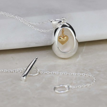 Oval Pendant With Miniature Hanging Heart Oval Pendant With Miniature Hanging Heart Silver