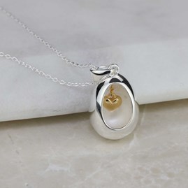 Oval Pendant With Miniature Hanging Heart Oval Pendant With Miniature Hanging Heart Silver