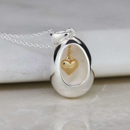 Oval Pendant With Miniature Hanging Heart Oval Pendant With Miniature Hanging Heart