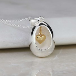 Oval Pendant With Miniature Hanging Heart
