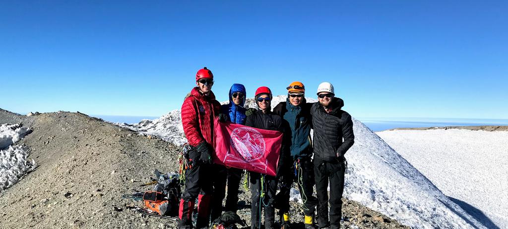 The team at the summit - holding the HMC flag