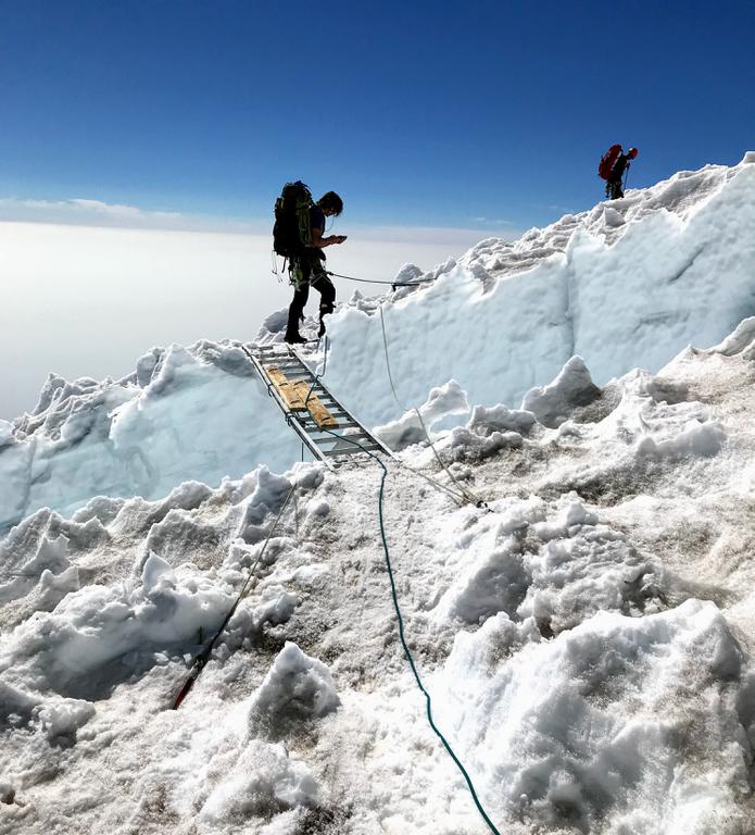 The crevasses on the descent were no joke. The guides had put up aluminum ladders to cross them though. Thanks again to the Rainier guides