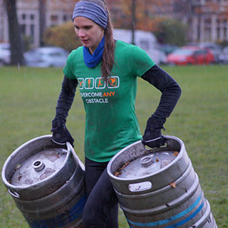 Sara Carrying Kegs at training