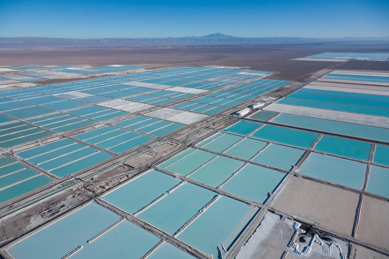 Chile, Antofagasta region, San Pedro de Atacama, Atacama salar, the world’s largest lithium deposit, evaporation ponds of the Sociedad Quimica Mineral de Chile lithium mine or SQM and Sociedad Chilena del Litio or SCL (aerial view)