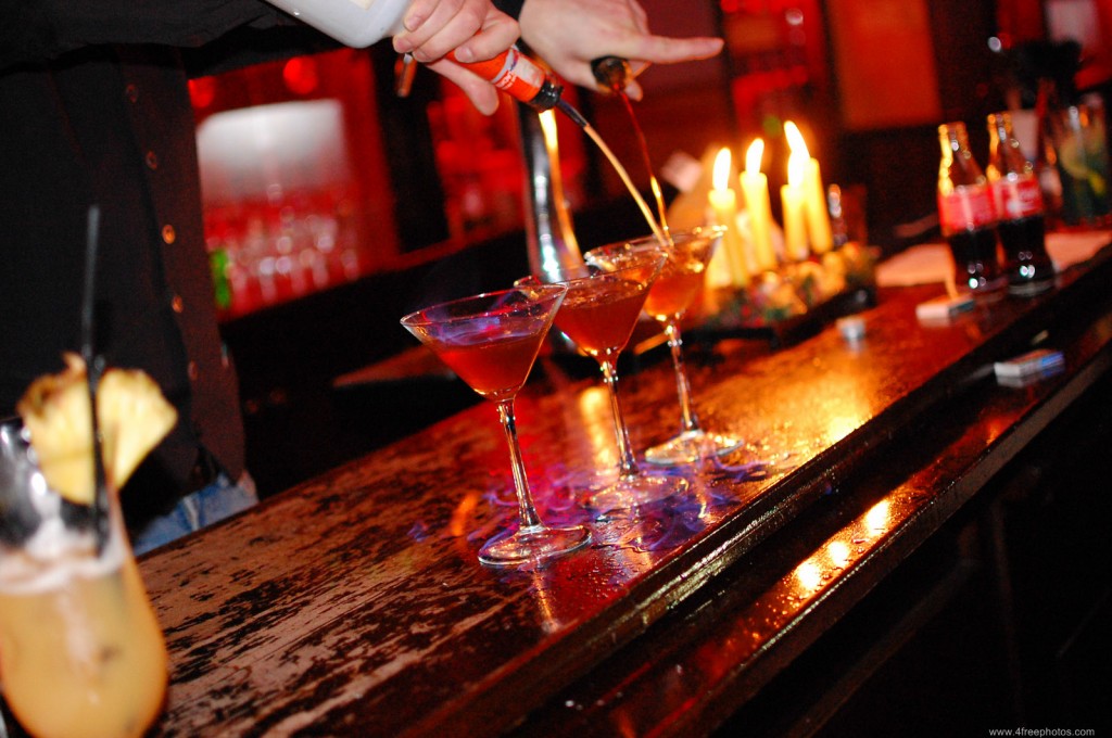 Barman pouring liquor