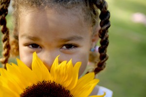 Little girl with sunflower