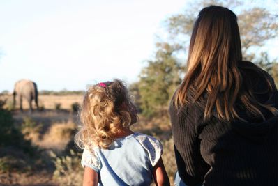 Mother and daughter on elephant safari