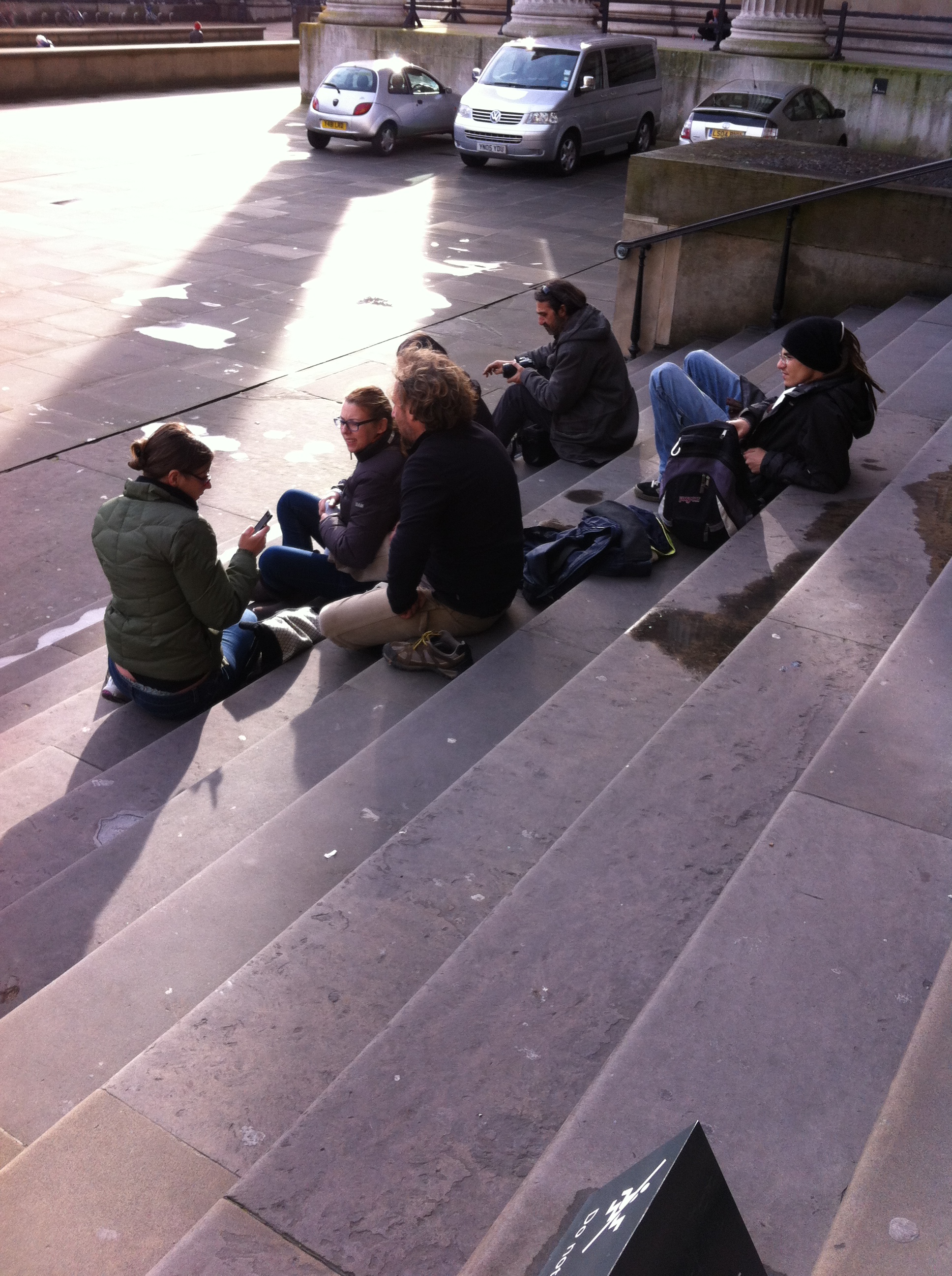 Tourists sitting on the steps of the British Museum