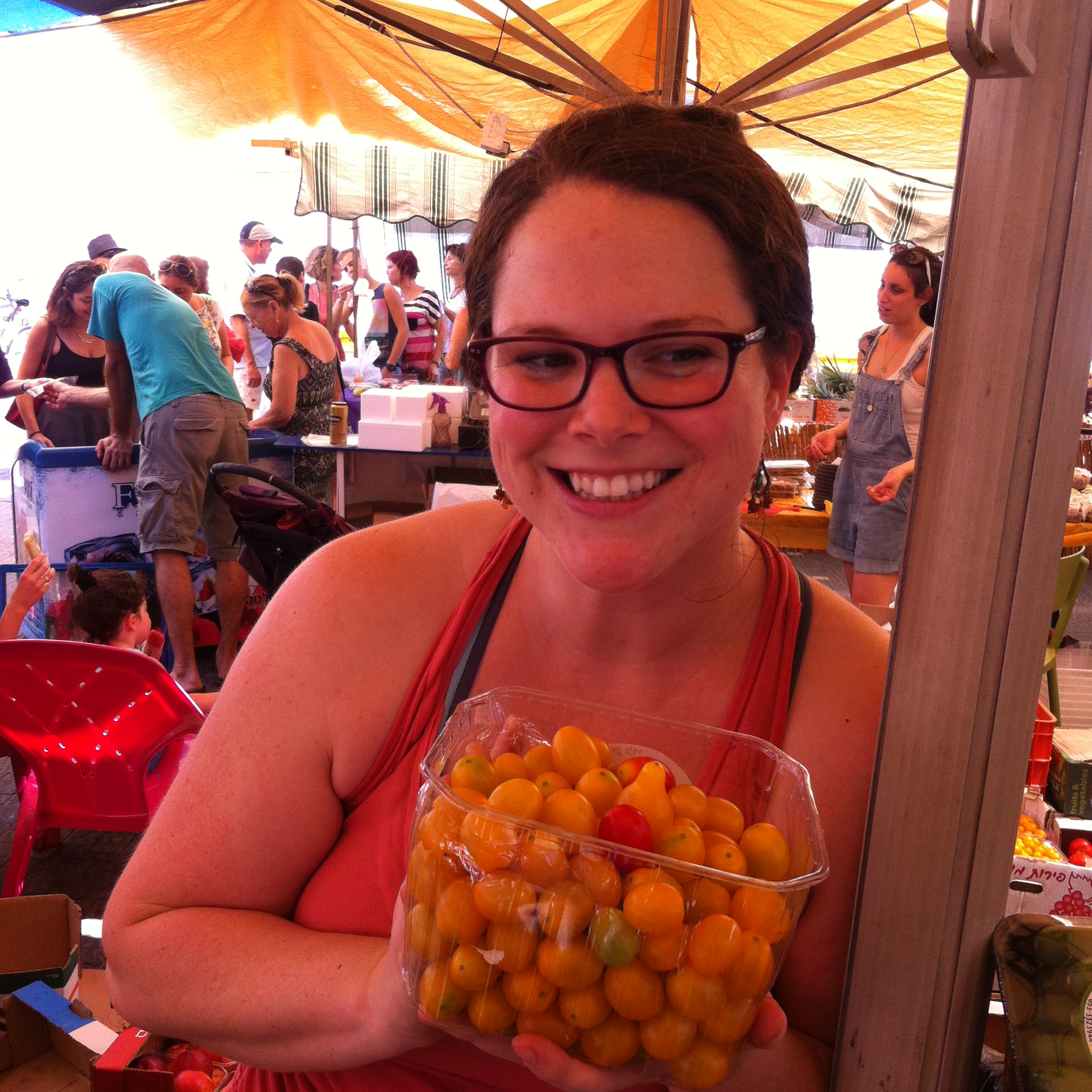 Talia grows colorful tomatoes, and sweet little peppers