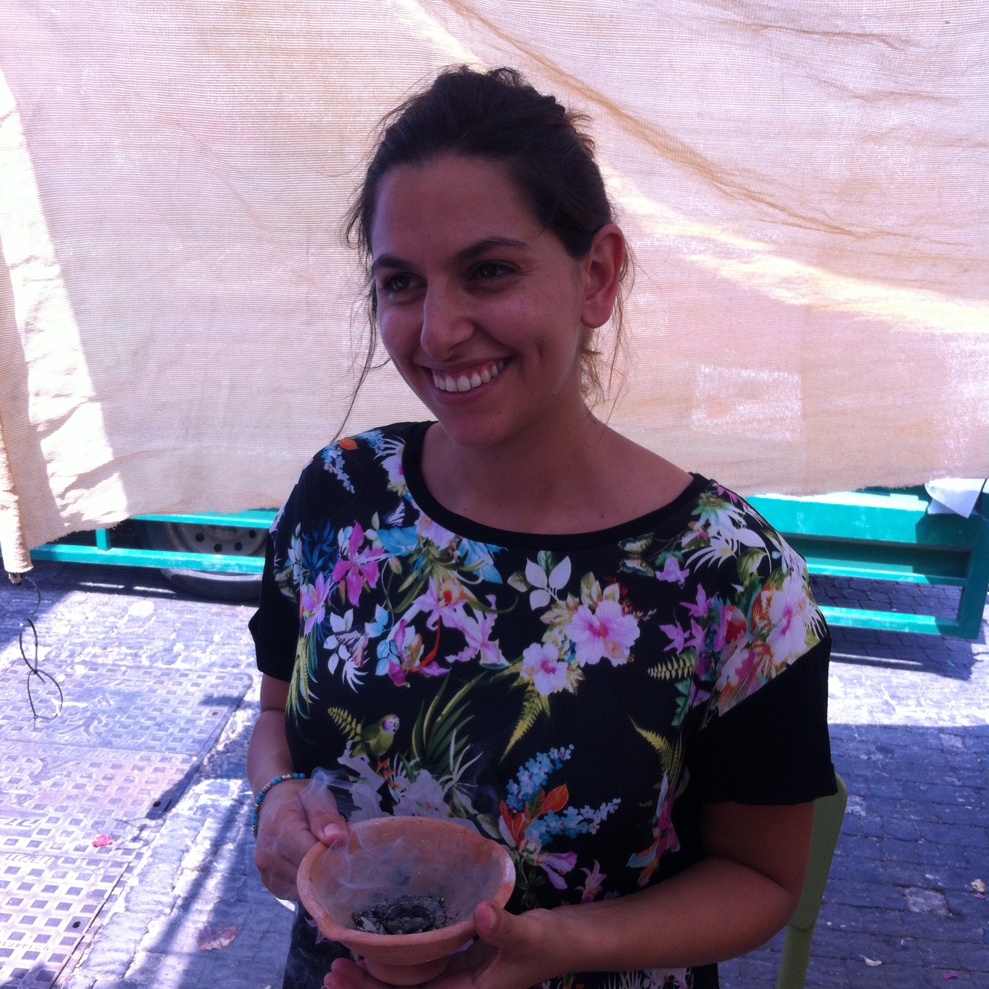 Ayelet sells incence at the farmer