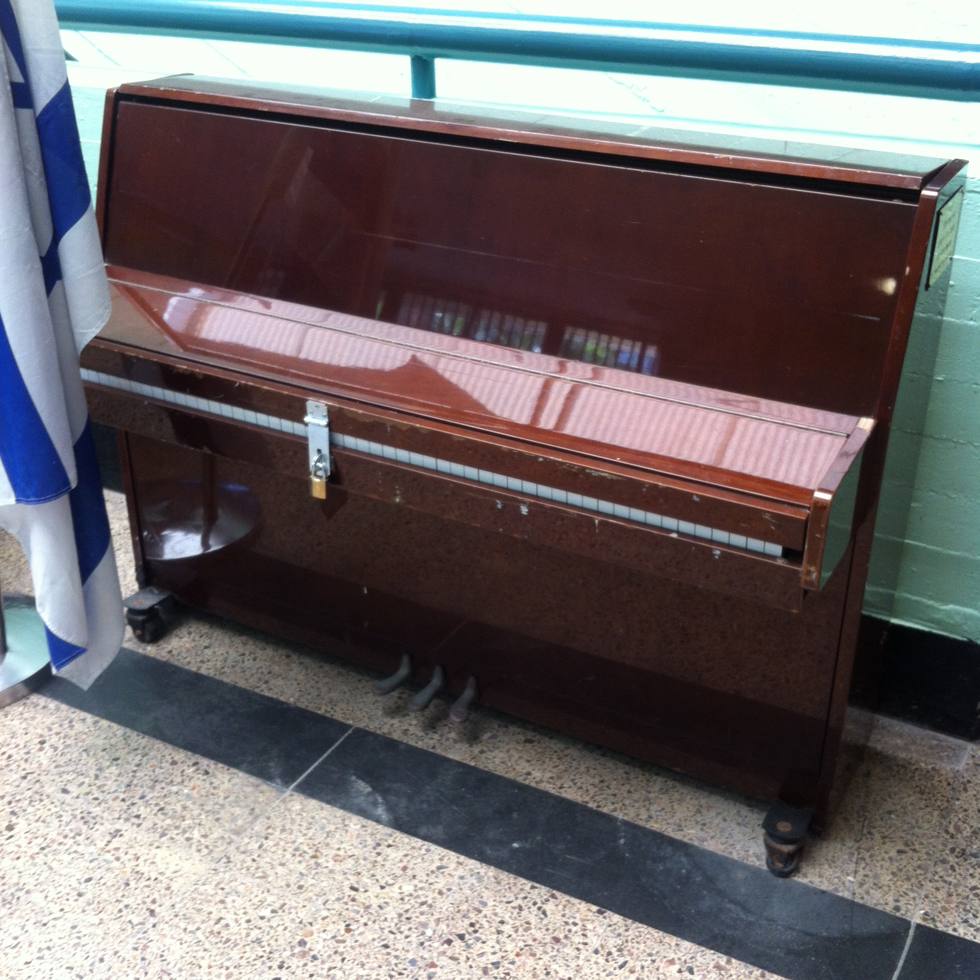 a locked piano in the foyer of Irony Hey high school