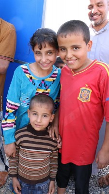 October 31 2016. Jadah camp, Qayyarrah (80km south of Mosul) in Iraq. Fayona (11), Fawz (10), Wajeeh (4) arrived in Jad-ah camp 3 days ago with their family. They came with 100 families from a village south of Mosul. IS had tried to take the villagers north further into their territory its thought with the intention of using them as human shields, according to the UN. As the villagers were taken north, conflict erupted between Iraqi and IS forces and the villagers managed to escape. Initially all 100 families were sheltered by their tribal leaders in his house but received news that IS were coming to kill them so fled to Jadah camp. Nearly 1,000 families around 5-6,000 people have arrived in Jadah camp in the past few days. Save the Children is putting up temporary learning spaces to get up to 800 primary age children learning again. Fayona (11), Fawz (10), Wajeeh (4) and their family are one of nearly 1,000 families that received water from Save the Childrens distribution on 31 October.
