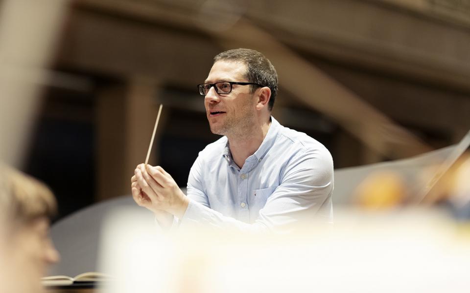 John Wilson_credit Astrid Ackermann Photo of conductor John Wilson