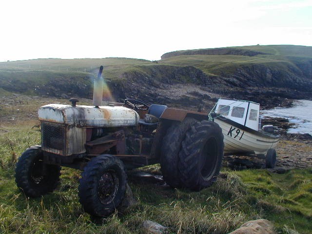 Old tractor and boat