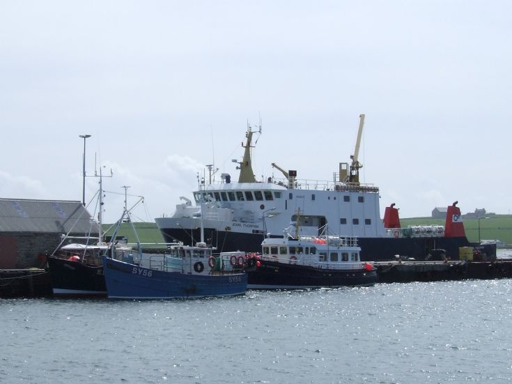 Fishing boats and ferries ,pierowall