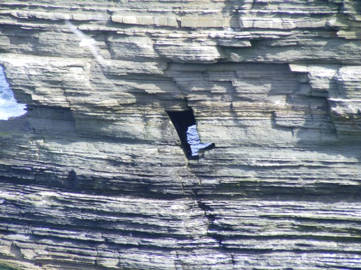 Hole in cliff