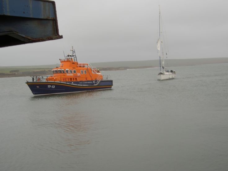 Inanna being escorted into Stronsay harbour