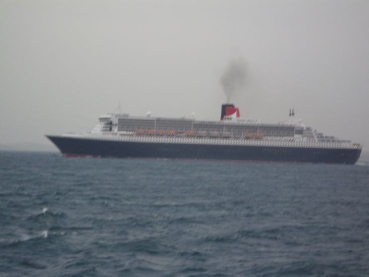 QM passing astern of Pentalina.