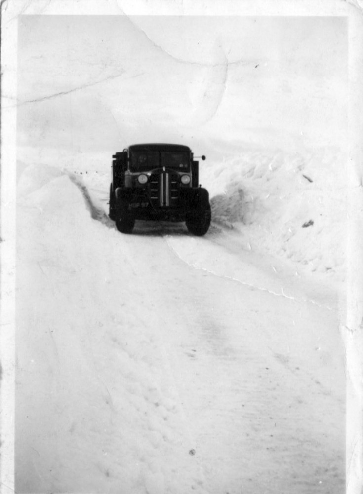 Oil depot truck in heavy snow drifts