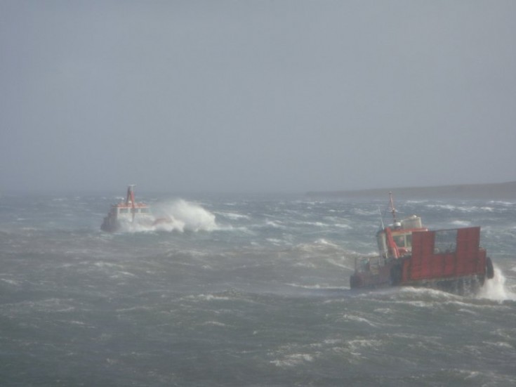 Fish farm boats in heavy seas