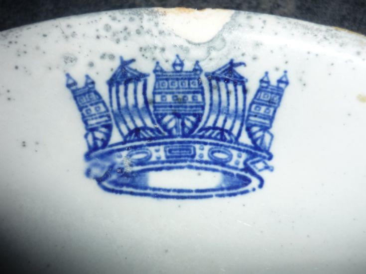 Logo on a broken plate from the flow