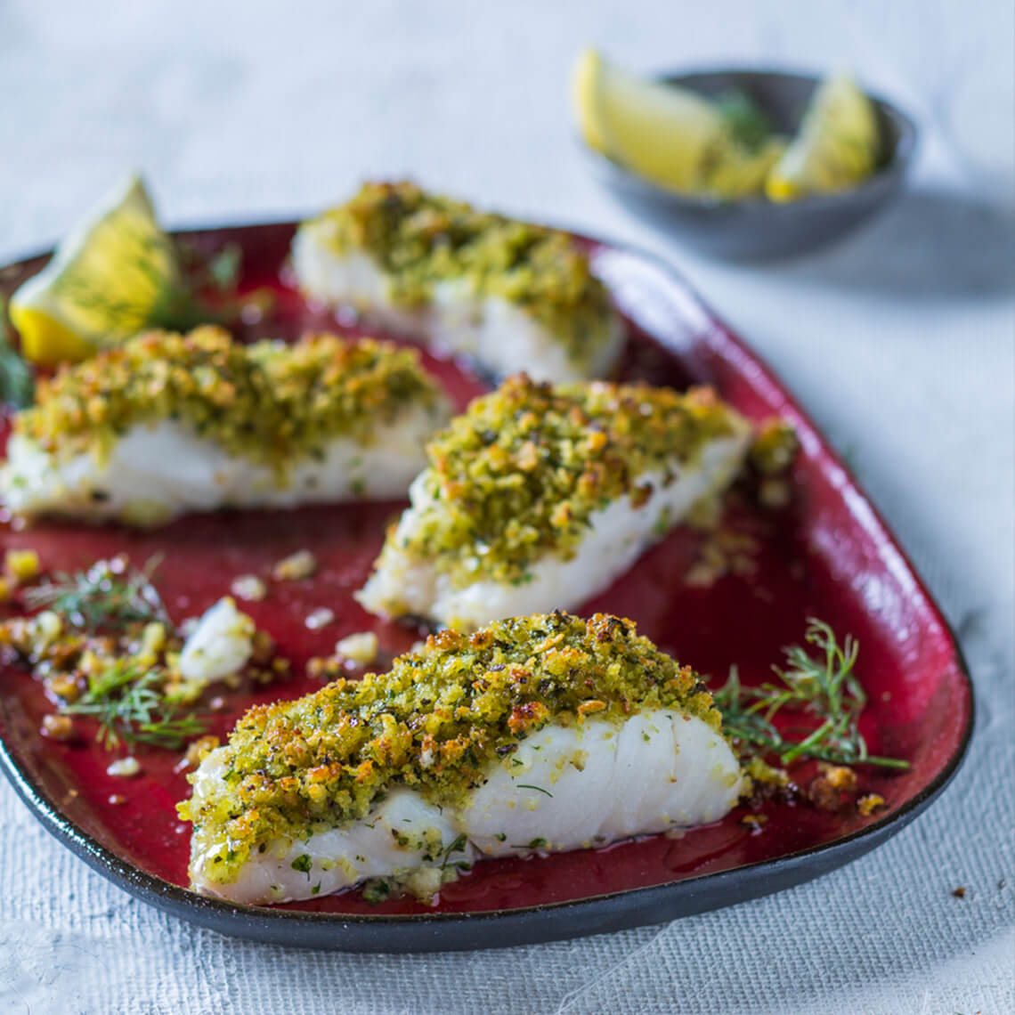 Herby crumbed hake fillets