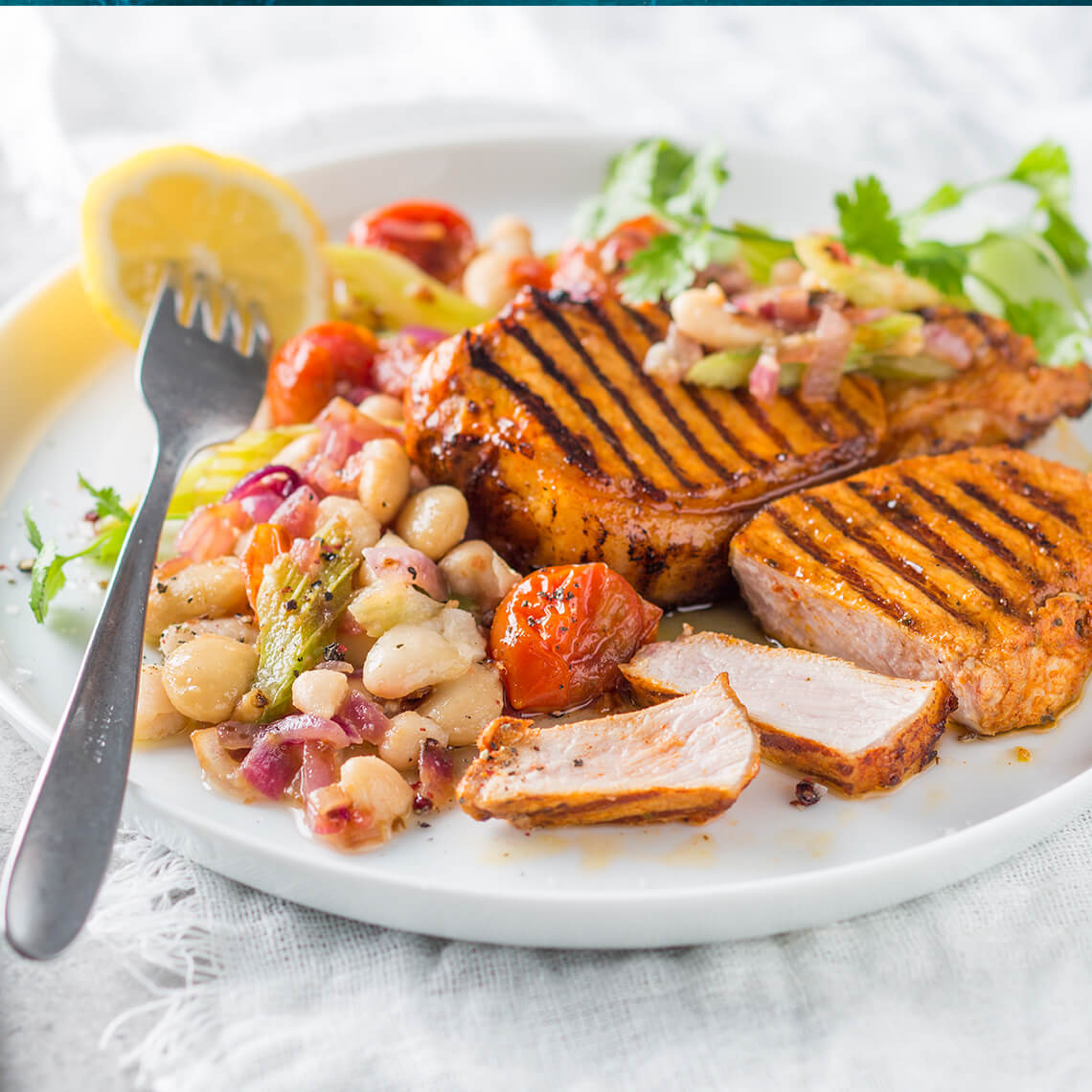 Paprika grilled pork chops with tomatobraised beans Recipes Pick n Pay